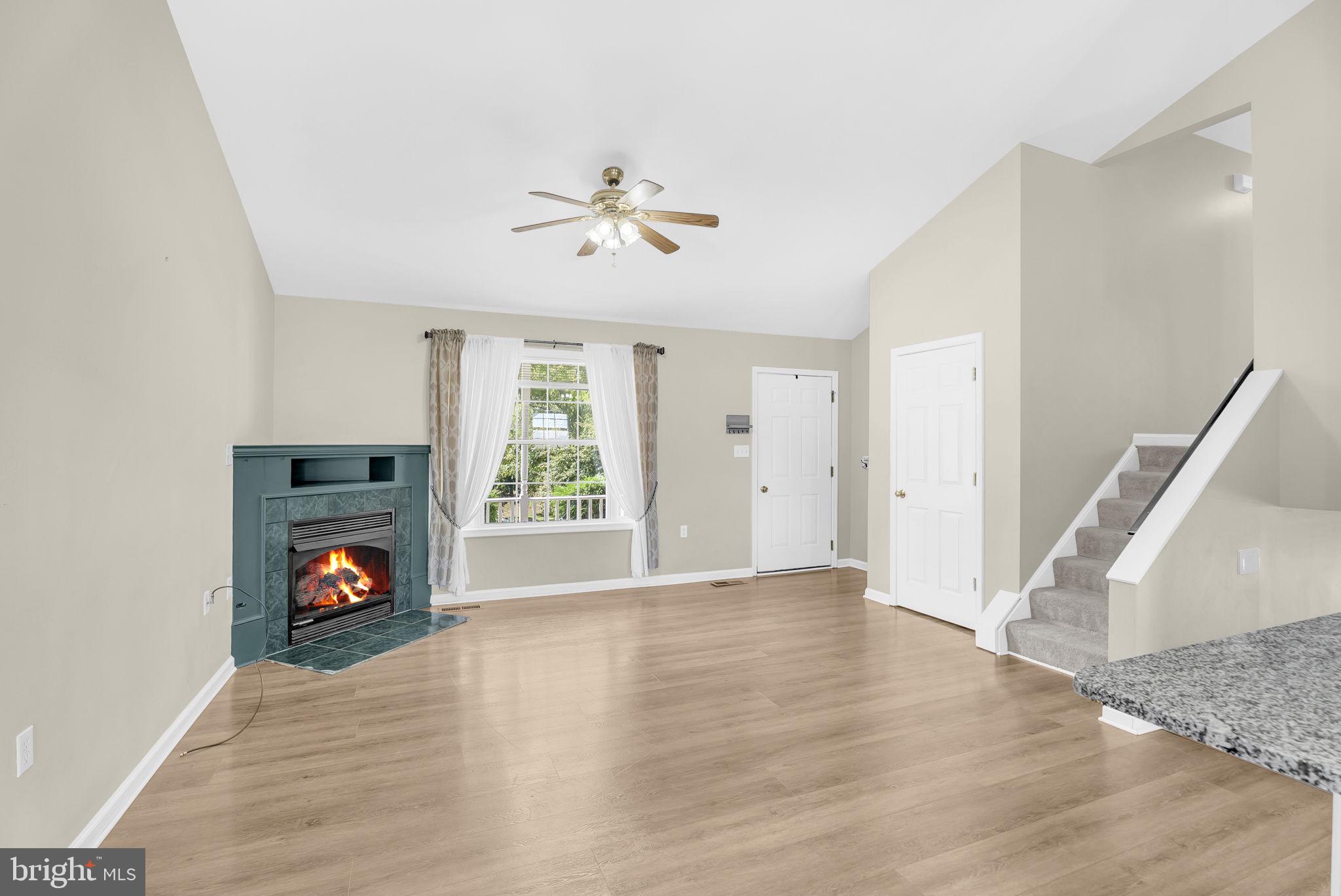 555 Oak Lee Drive Ranson, WV 25438 - Photo 8 of 40 Gas fireplace and lots of natural light