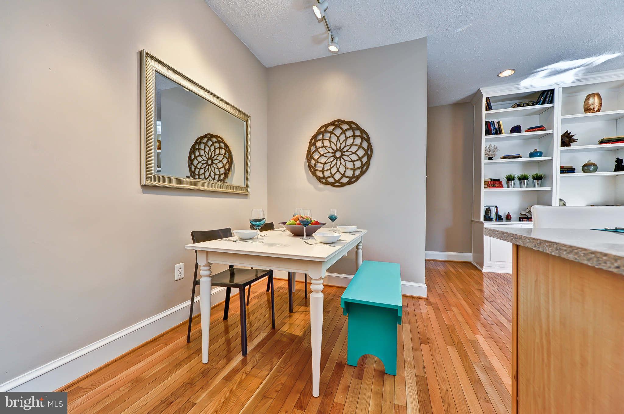 1401 Columbia Road Northwest, Unit 302 Washington, DC 20009 - Photo 12 of 30 a view of a workspace with furniture and wooden floor