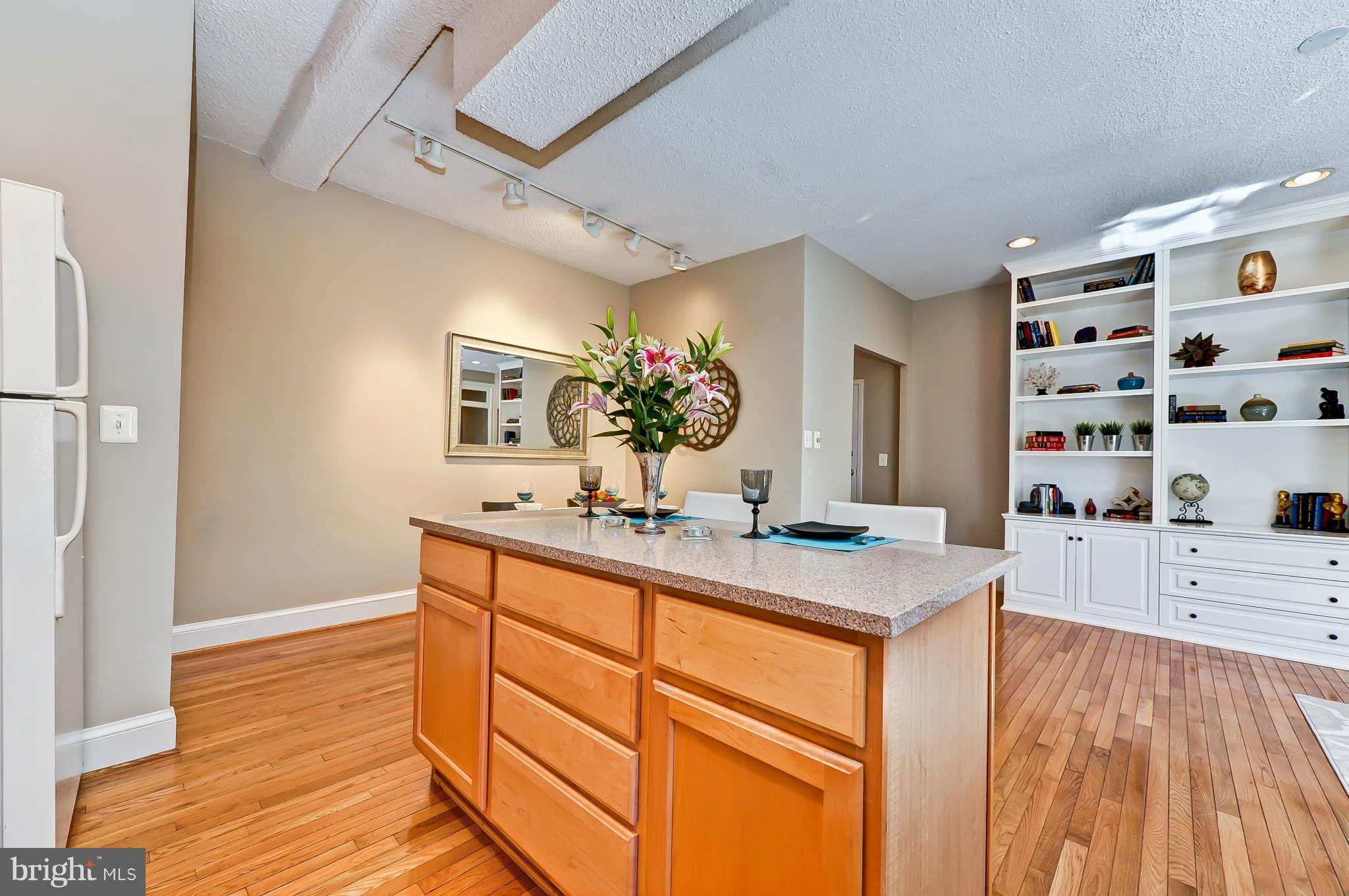 1401 Columbia Road Northwest, Unit 302 Washington, DC 20009 - Photo 17 of 30 a view of kitchen with cabinets and wooden floor