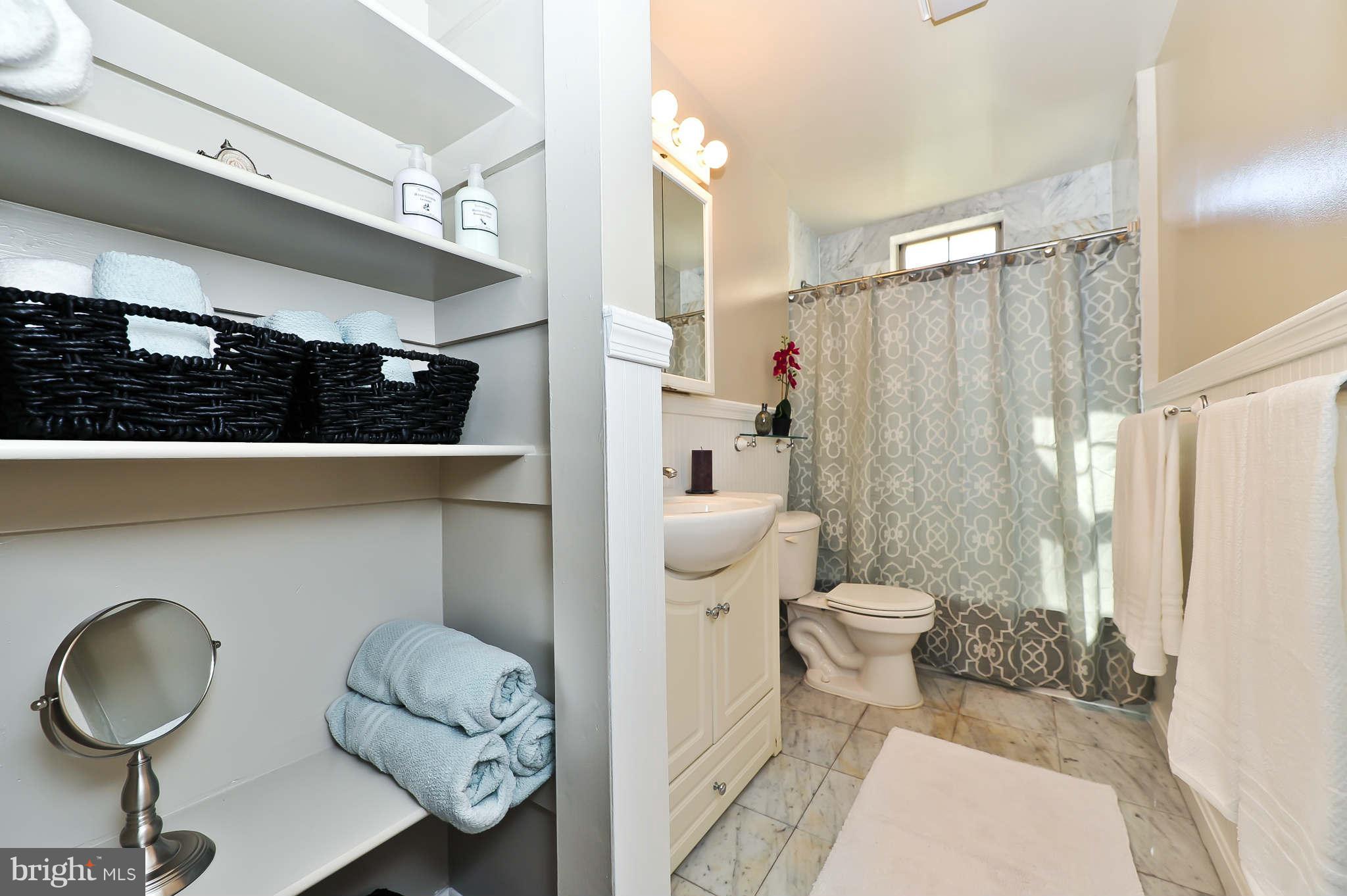 1401 Columbia Road Northwest, Unit 302 Washington, DC 20009 - Photo 20 of 30 a bathroom with a sink toilet and shower
