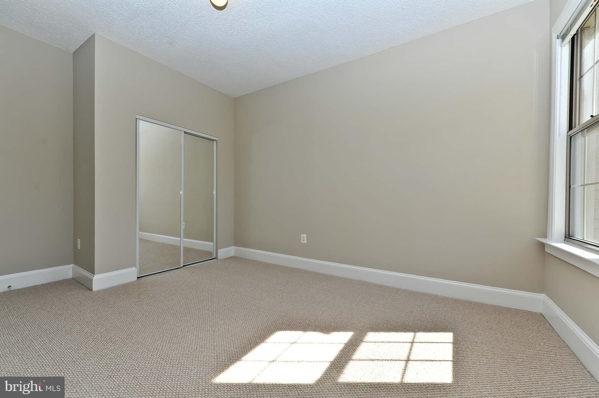 1401 Columbia Road Northwest, Unit 302 Washington, DC 20009 - Photo 24 of 30 an empty room with a window