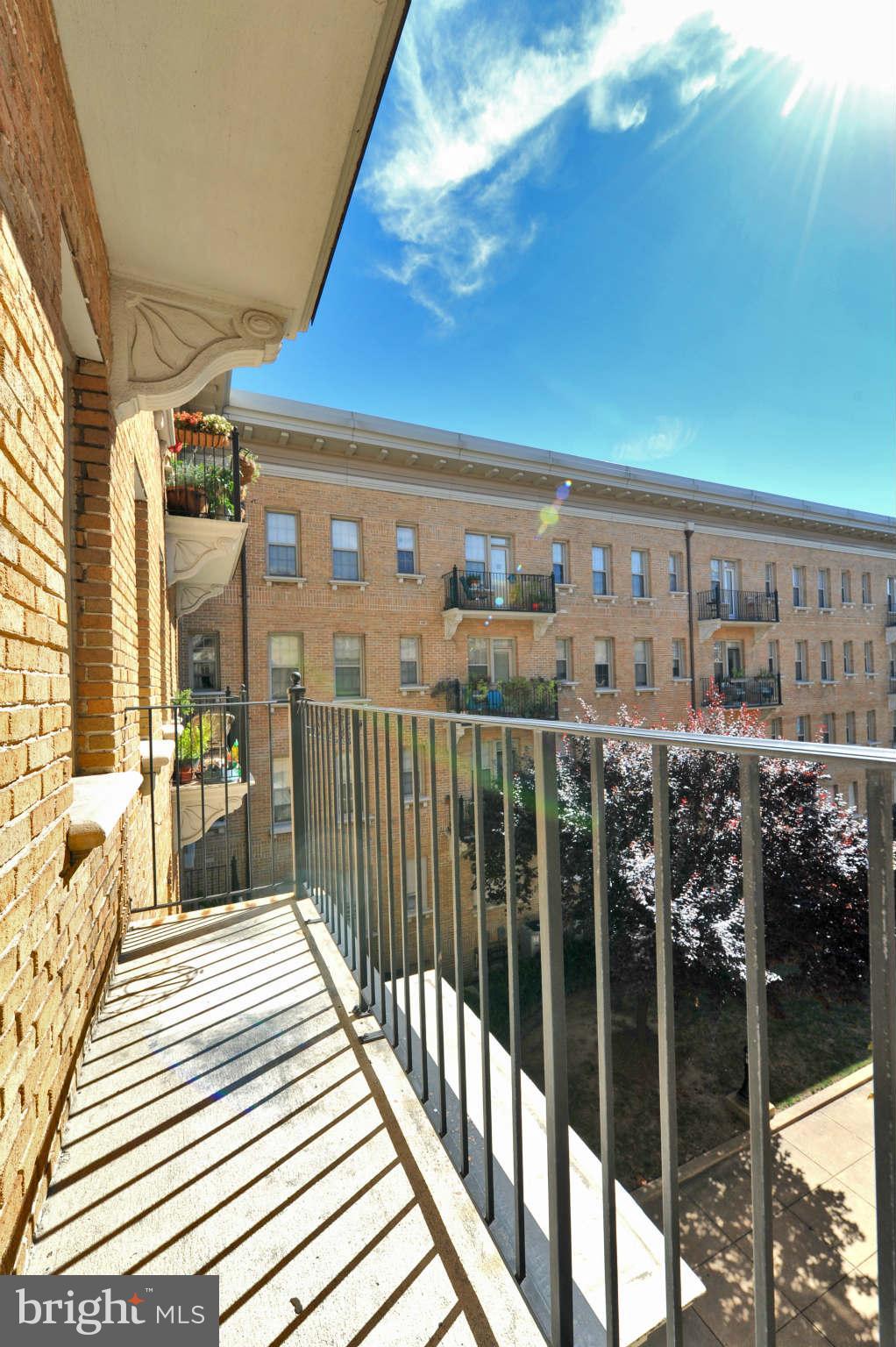 1401 Columbia Road Northwest, Unit 302 Washington, DC 20009 - Photo 27 of 30 a view of a balcony with wooden floor