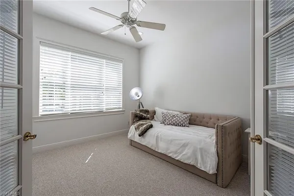 a bedroom with a bed and window