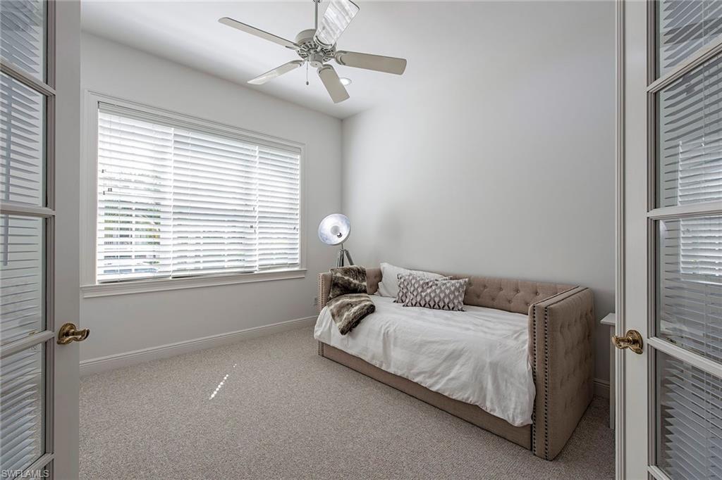 860 7th Street South Naples, FL 34102 - Photo 12 of 13 a bedroom with a bed and window