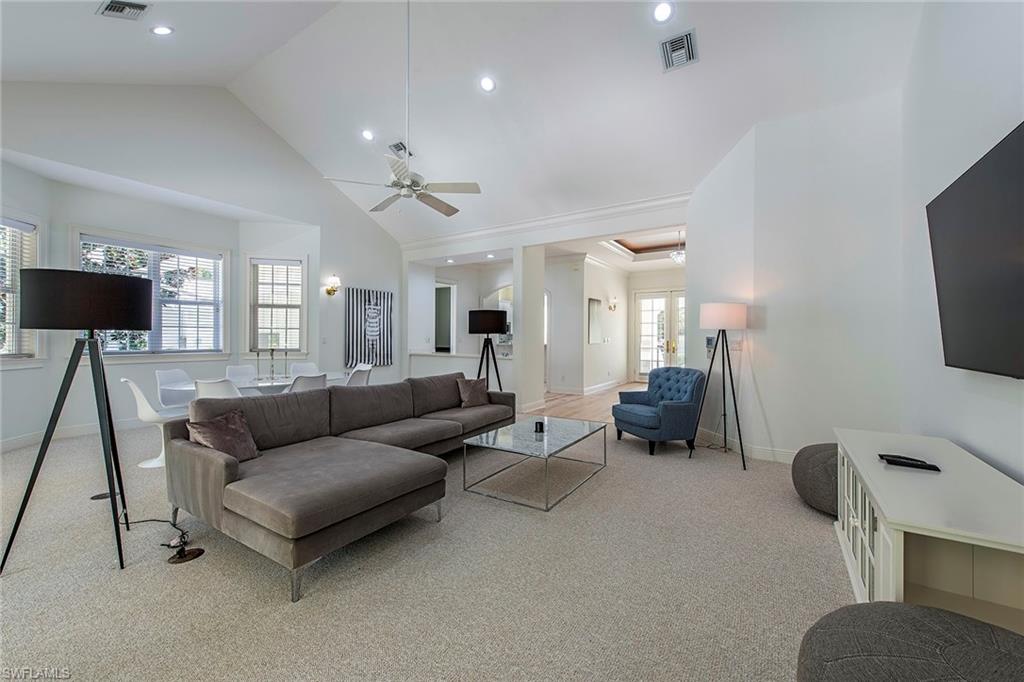860 7th Street South Naples, FL 34102 - Photo 3 of 13 a living room with furniture and a flat screen tv