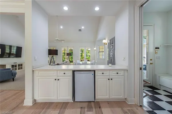 a spacious bathroom with a sink a mirror and a bathtub