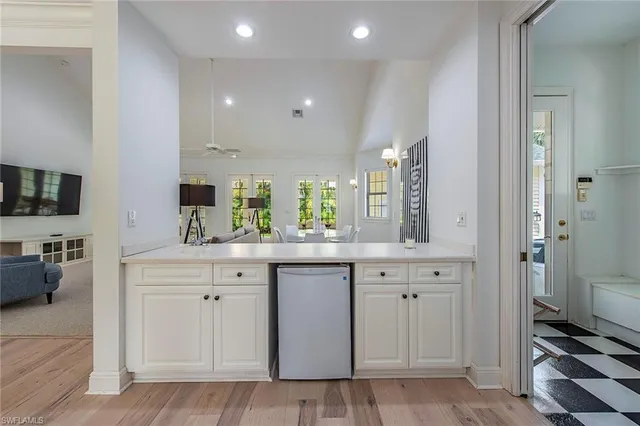 a spacious bathroom with a sink a mirror and a bathtub