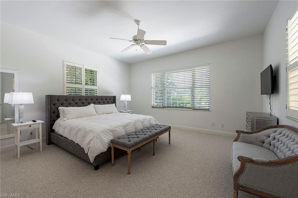 860 7th Street South Naples, FL 34102 - Photo 7 of 13 a bedroom with a bed and a flat screen tv