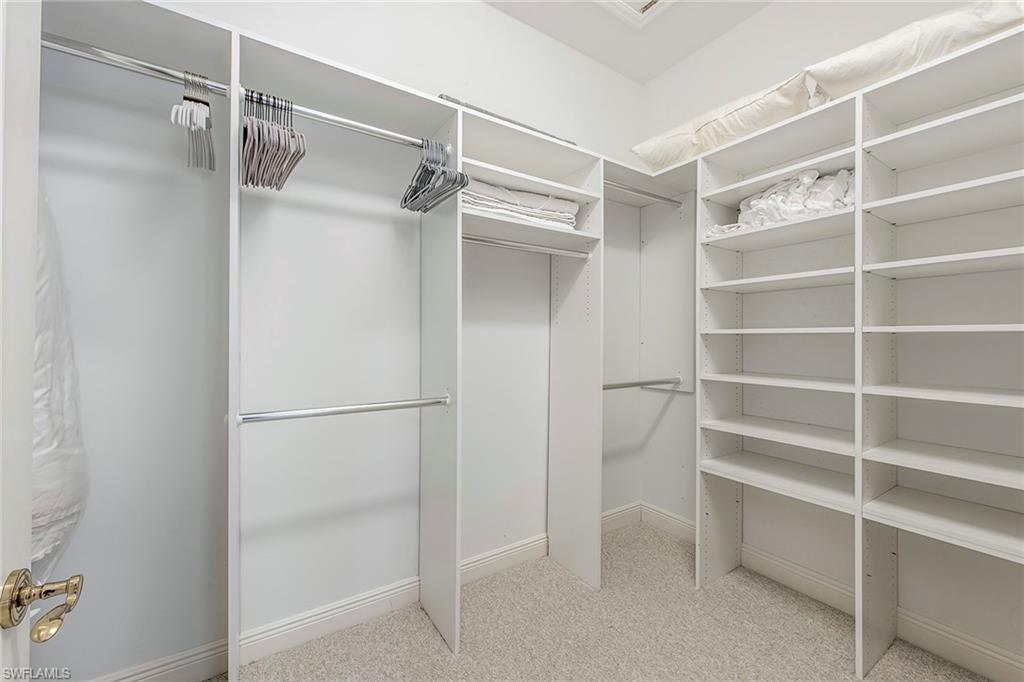860 7th Street South Naples, FL 34102 - Photo 8 of 13 a view of walk in closet with empty racks