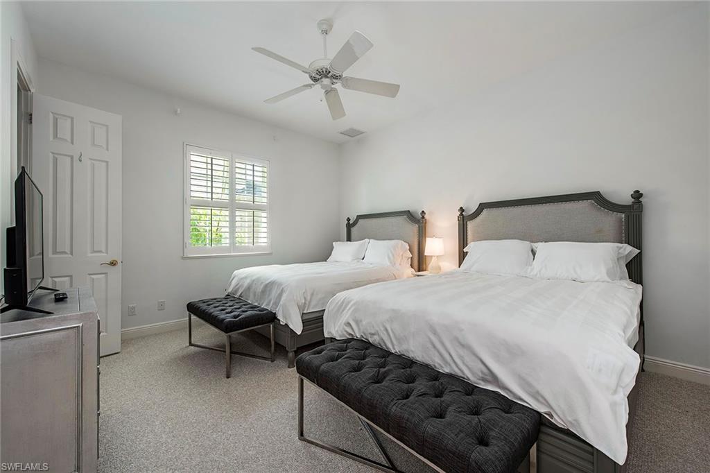 860 7th Street South Naples, FL 34102 - Photo 10 of 13 a bedroom with two beds and a flat screen tv