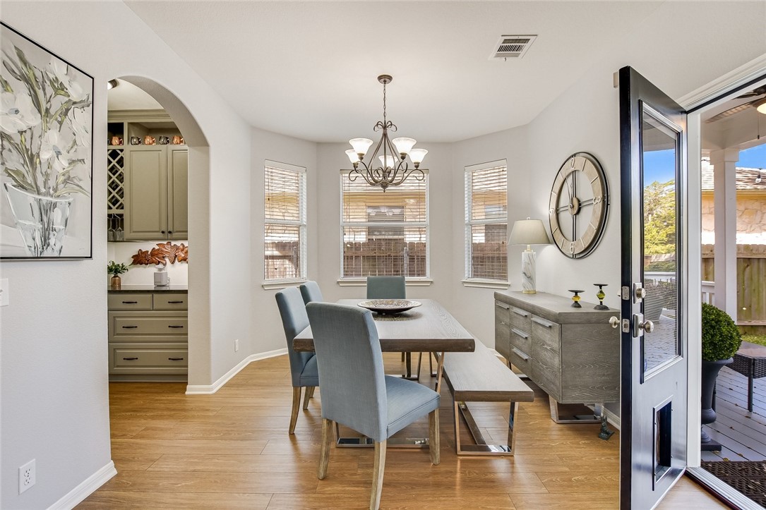 6405 York Bridge Circle Austin, TX 78749 - Photo 13 of 34 a view of a dining room with furniture window and wooden floor