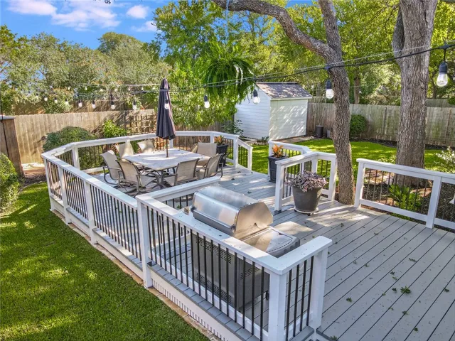 a view of a deck with couches and wooden floor