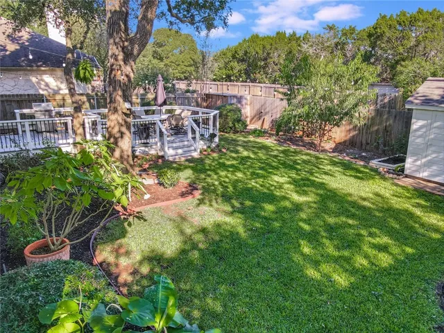 a view of a chairs and table in the garden