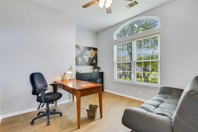 a living room with furniture and a window