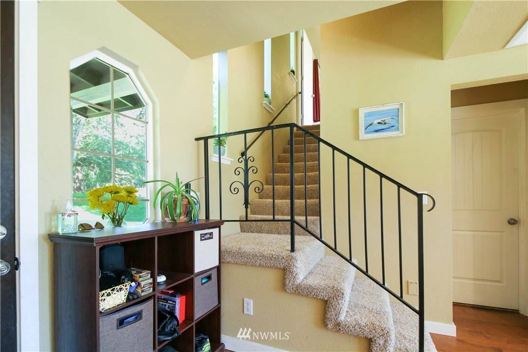 27615 Webster Road East Graham, WA 98338 - Photo 13 of 36 a view of entryway and hall with wooden floor
