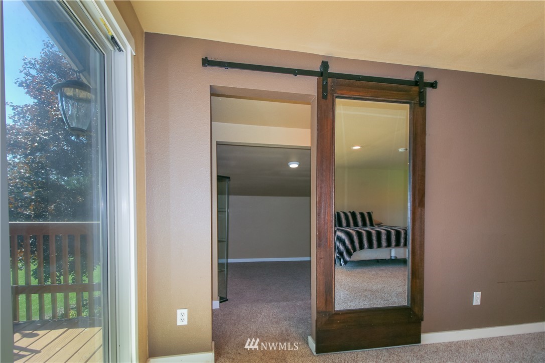 27615 Webster Road East Graham, WA 98338 - Photo 17 of 36 a view of a glass door and a door