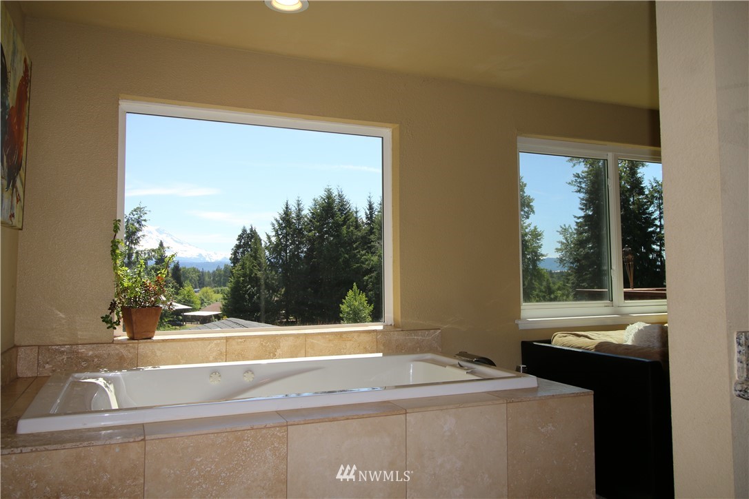 27615 Webster Road East Graham, WA 98338 - Photo 20 of 36 a view of a bathroom with a sink and a large window