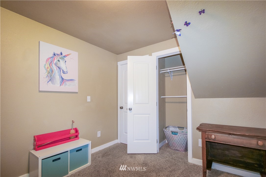 27615 Webster Road East Graham, WA 98338 - Photo 28 of 36 a hallway with a workspace