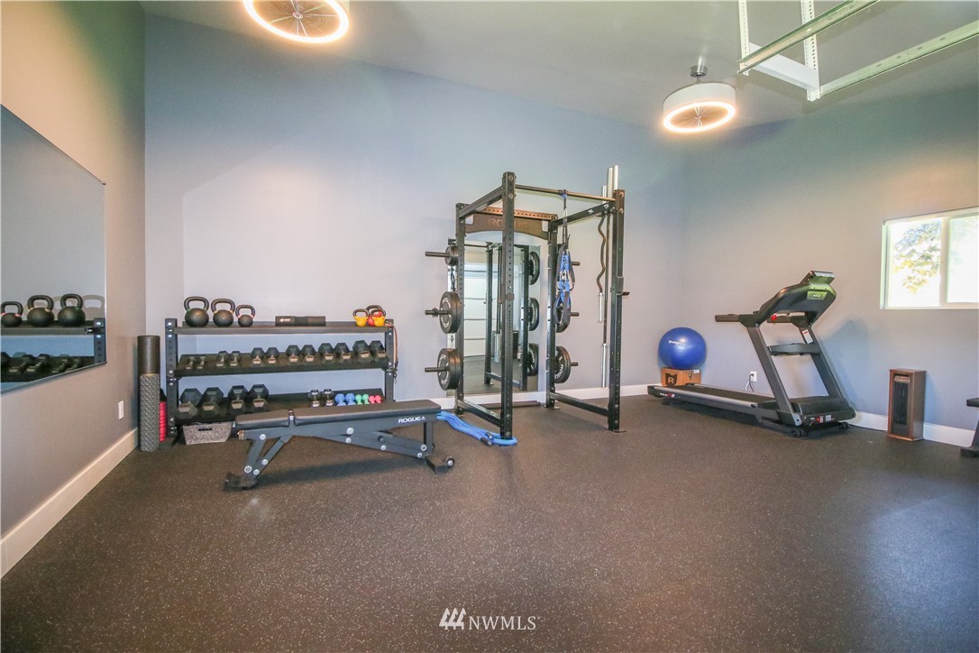 27615 Webster Road East Graham, WA 98338 - Photo 34 of 36 a view of a room with gym equipment