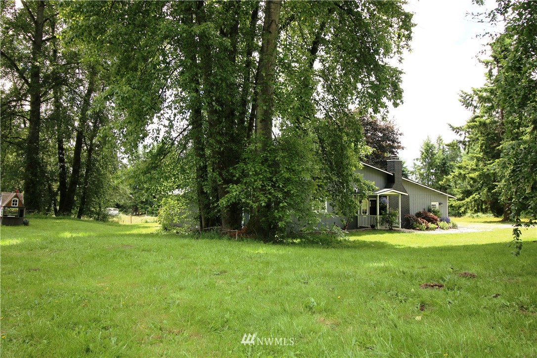 27615 Webster Road East Graham, WA 98338 - Photo 35 of 36 a view of a house with a big yard