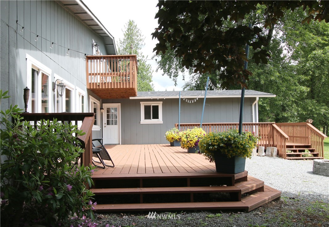 27615 Webster Road East Graham, WA 98338 - Photo 6 of 36 a front view of a house with garden