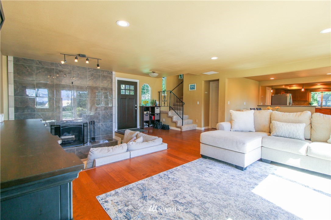 27615 Webster Road East Graham, WA 98338 - Photo 8 of 36 a living room with furniture and a large window