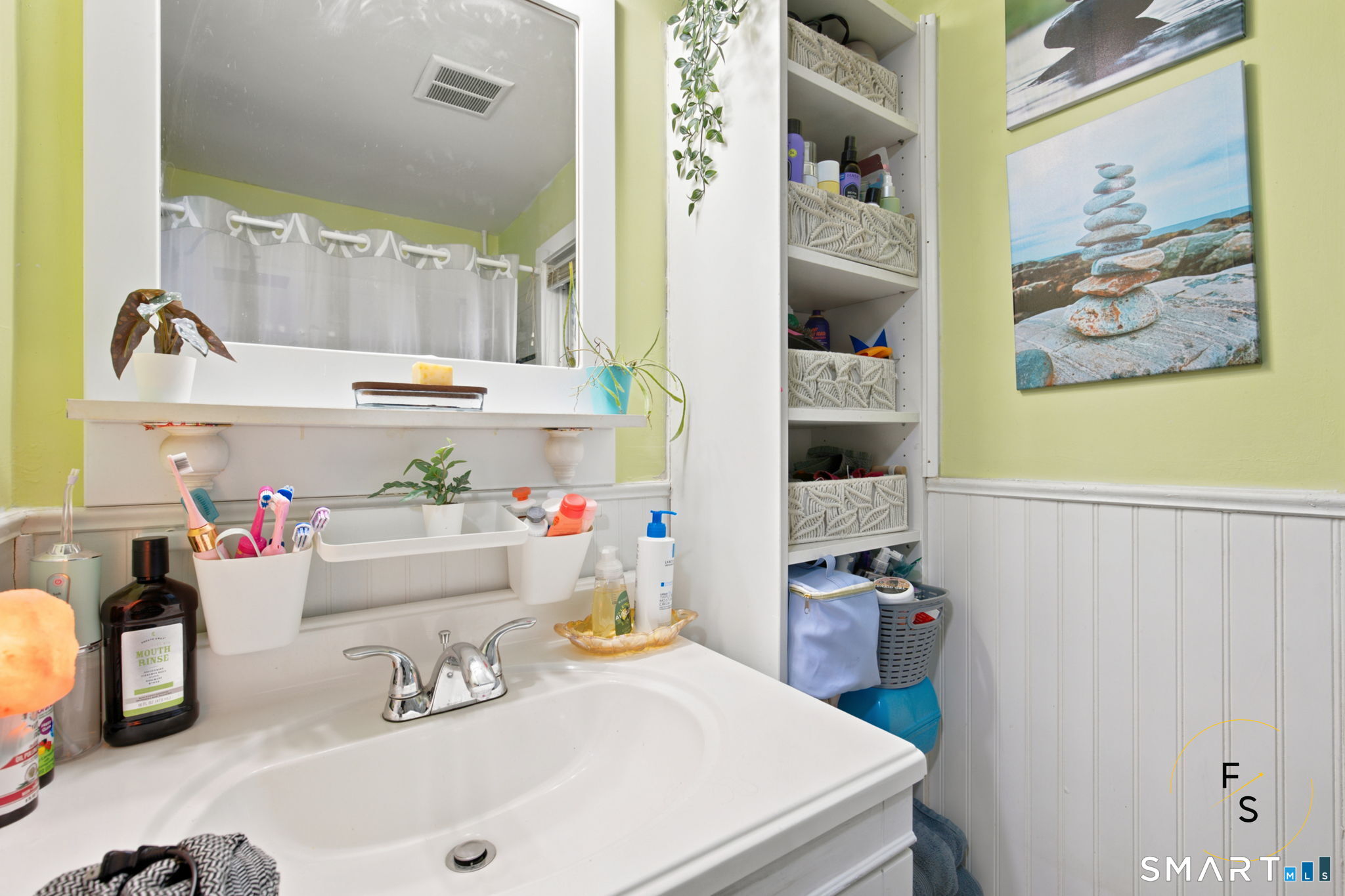182 Broad Street Norwich, CT 06360 - Photo 19 of 30 a bathroom with a sink and a mirror