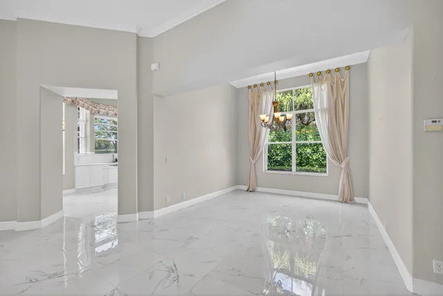a view of a livingroom with furniture and a window