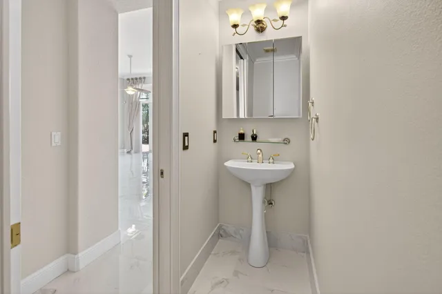 a view of garden with a bench in front of it