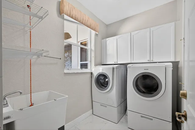 a view of a room with wooden floor and iron stairs