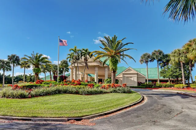 an aerial view of a house with yard swimming pool and outdoor seating