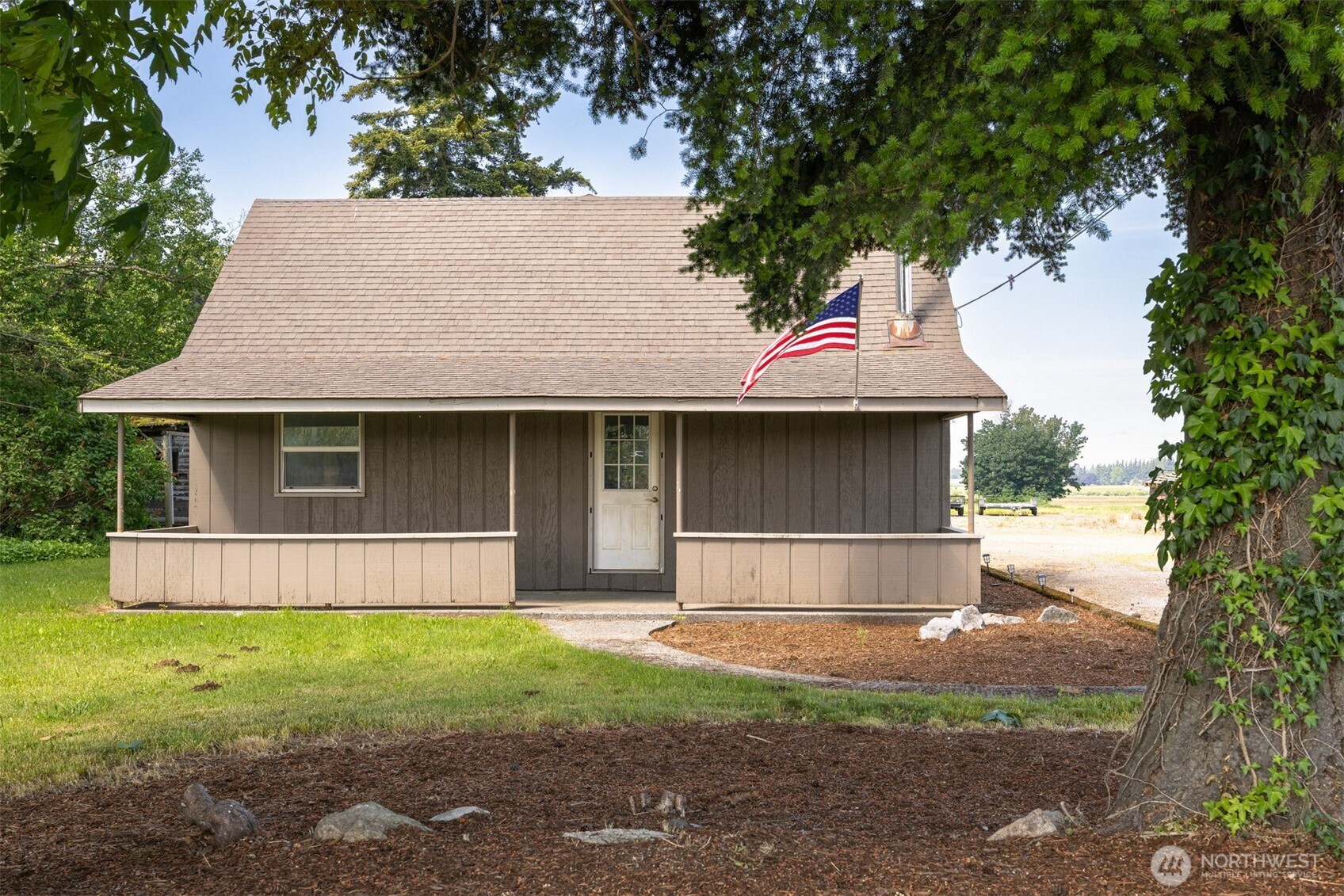 6791 Noon Road Everson, WA 98247 - Photo 3 of 38 a front view of a house with a yard and garage