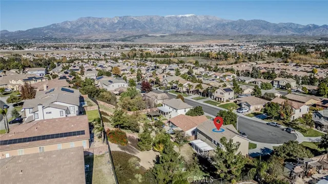 an aerial view of residential house and sandy dunes