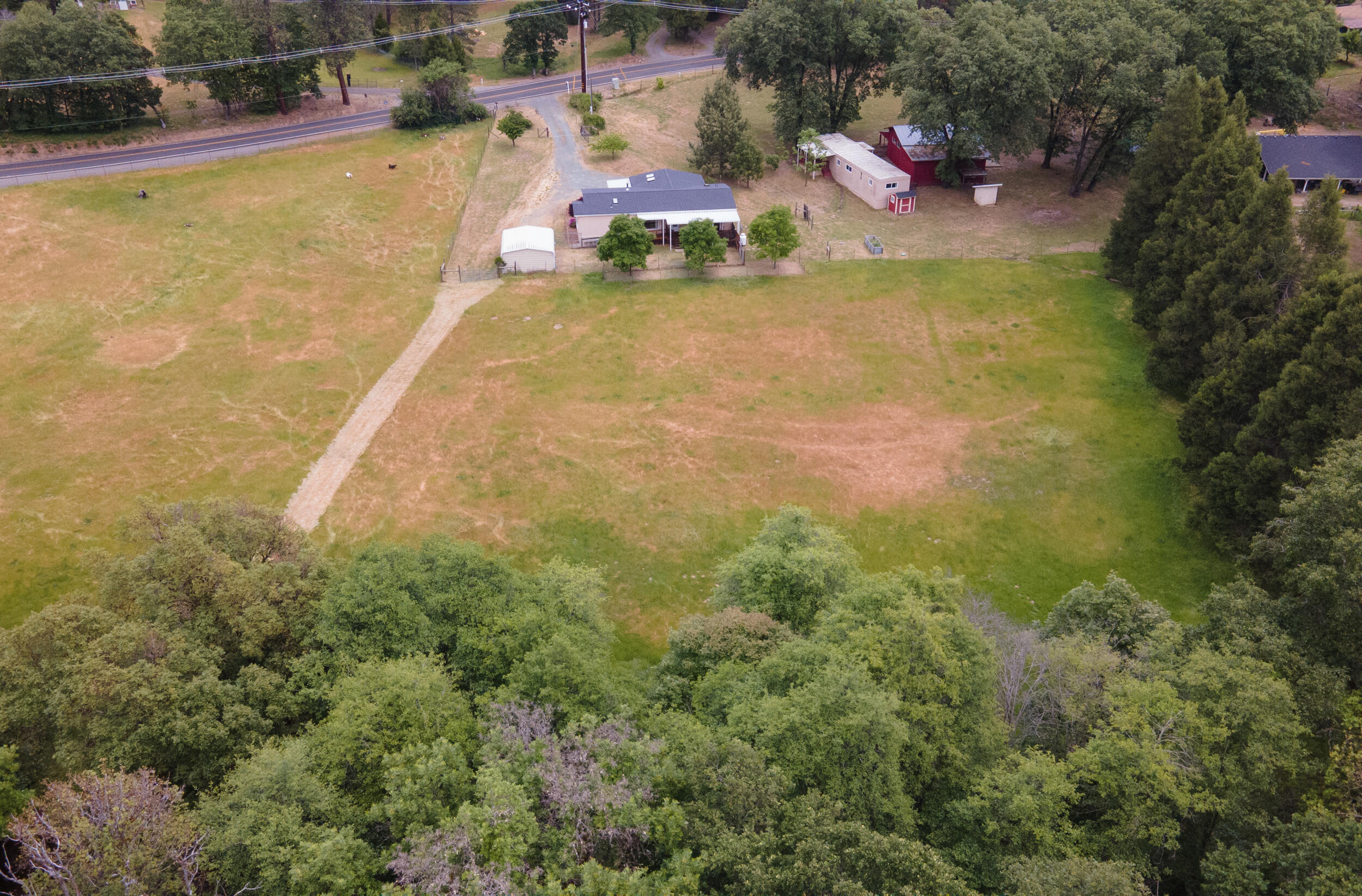 2720 Hugo Road Merlin, OR 97532 - Photo 4 of 38 a view of the property from above the creek