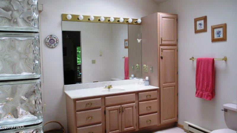 804 Rodeo Court Hawley, PA 18428 - Photo 14 of 37 a bathroom with a sink and a mirror