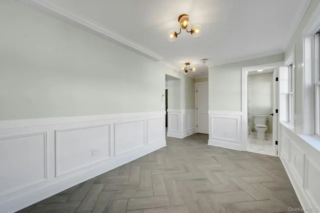 a view of a chandelier fan and entryway