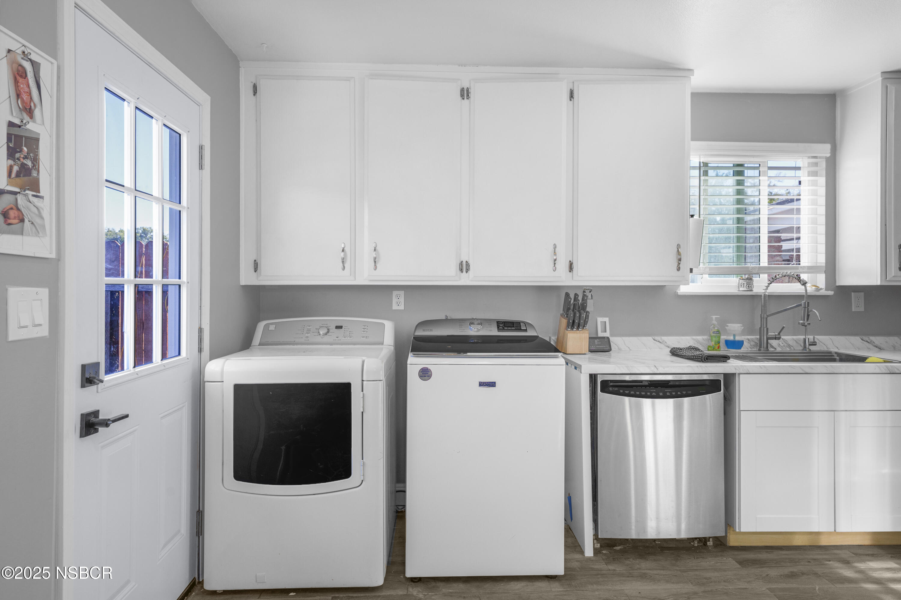 3939 Saturn Avenue Lompoc, CA 93436 - Photo 12 of 26 a kitchen with stainless steel appliances granite countertop a stove a microwave and a white refrigerator