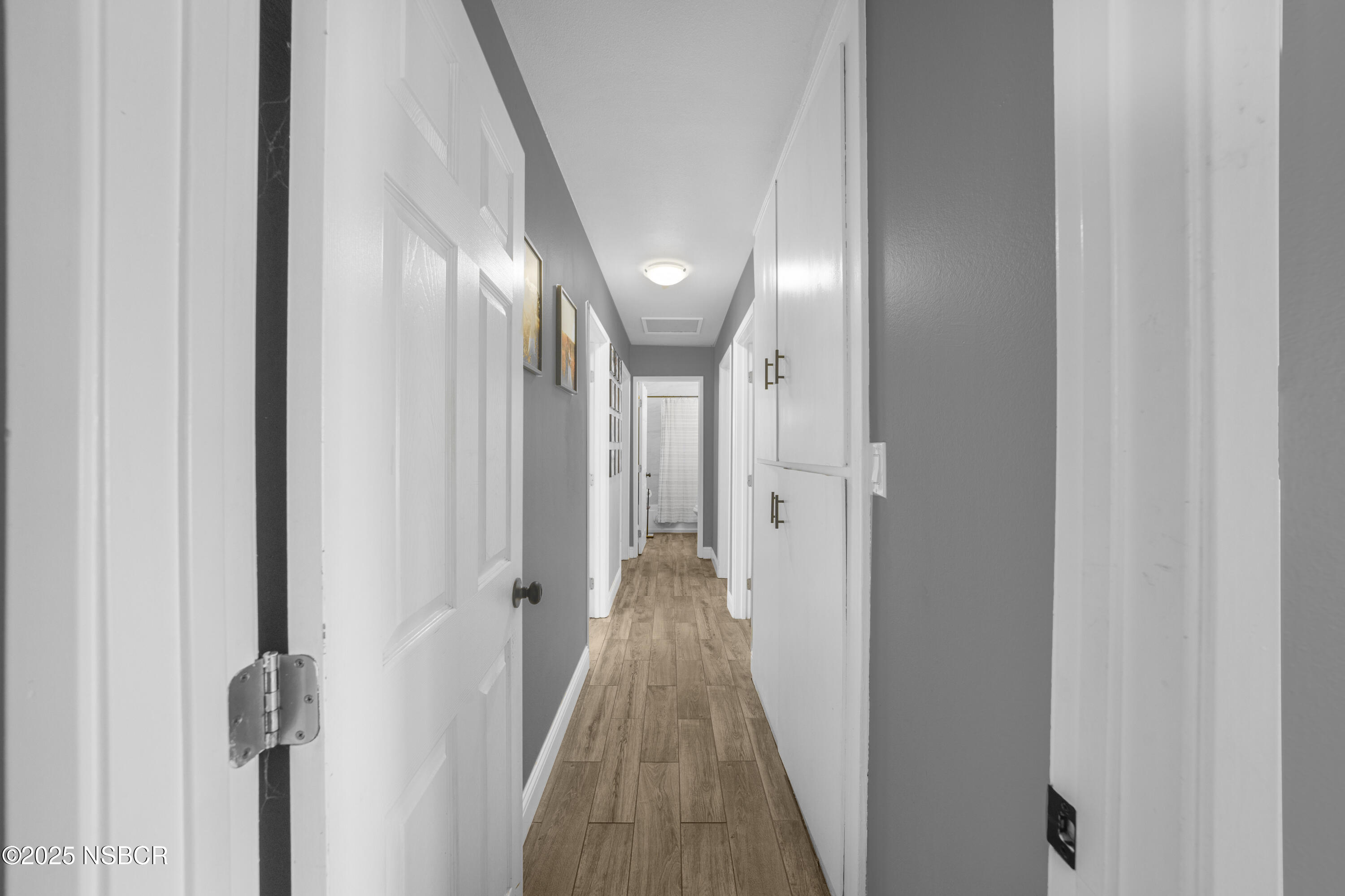 3939 Saturn Avenue Lompoc, CA 93436 - Photo 13 of 26 a view of a hallway with wooden floor