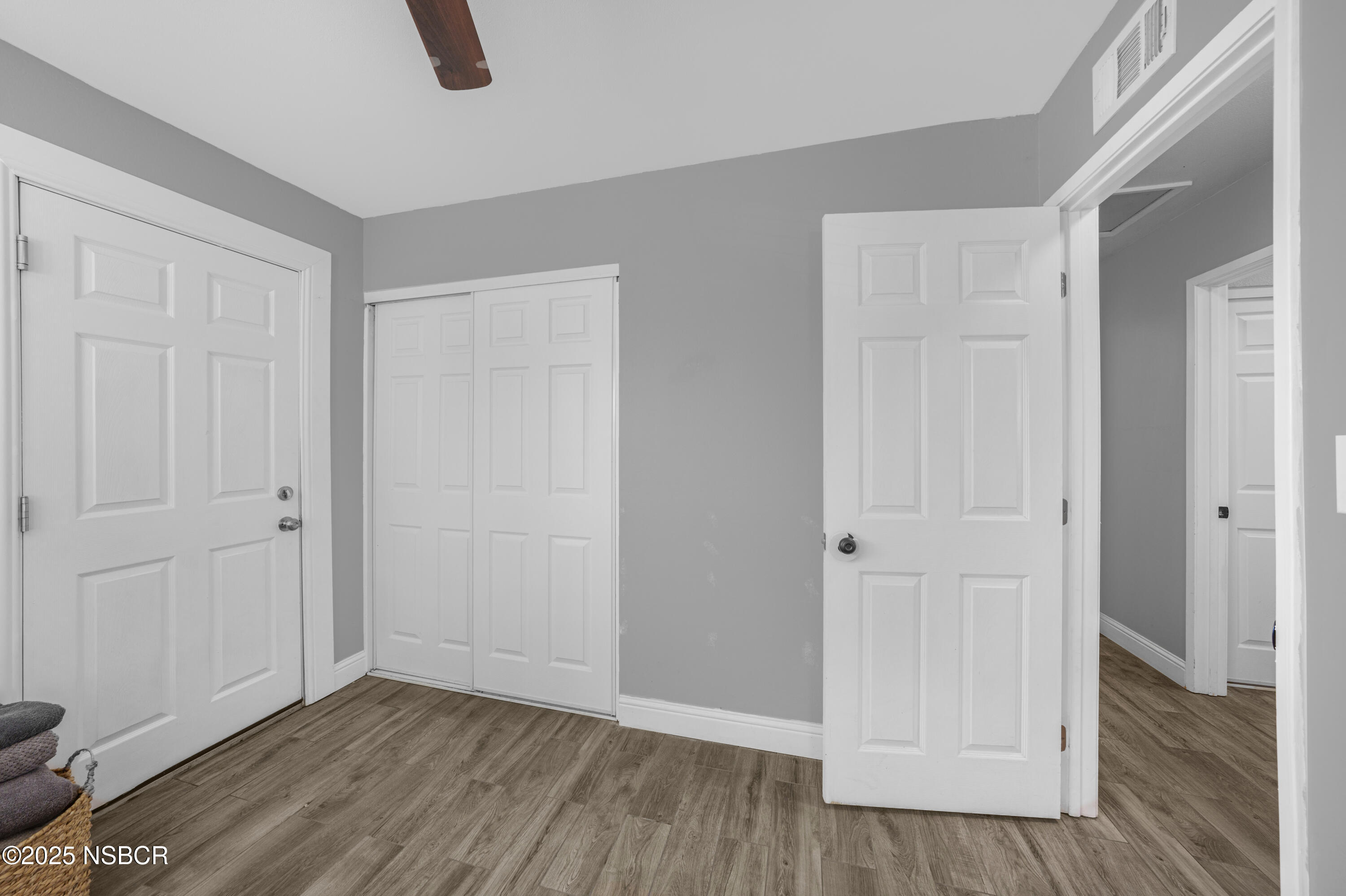 3939 Saturn Avenue Lompoc, CA 93436 - Photo 20 of 26 an empty room with closet and wooden floor