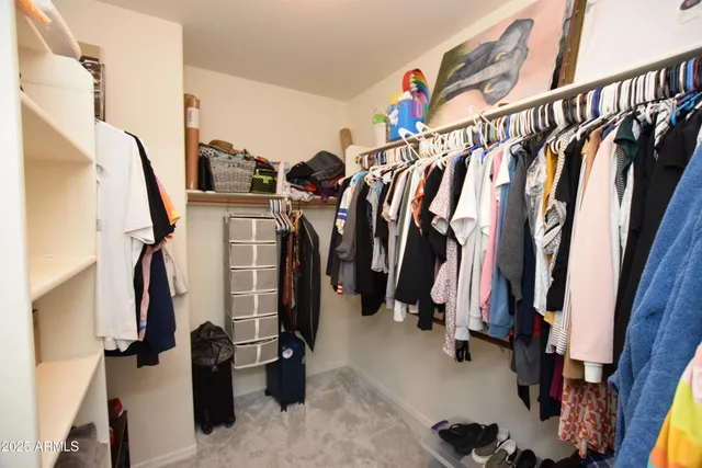 a view of a livingroom with furniture and a dining room