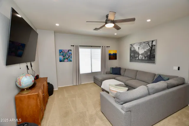 a living room with furniture and white walls