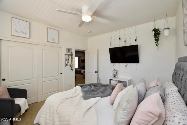 a bathroom with a toilet mirror and vanity