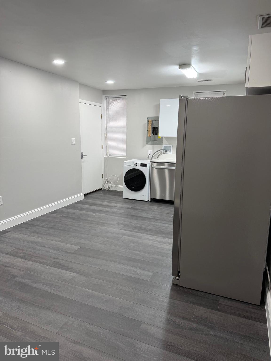 2511 Maryland Avenue, Unit 3 Baltimore, MD 21218 - Photo 5 of 11 a view of an empty room with wooden floor