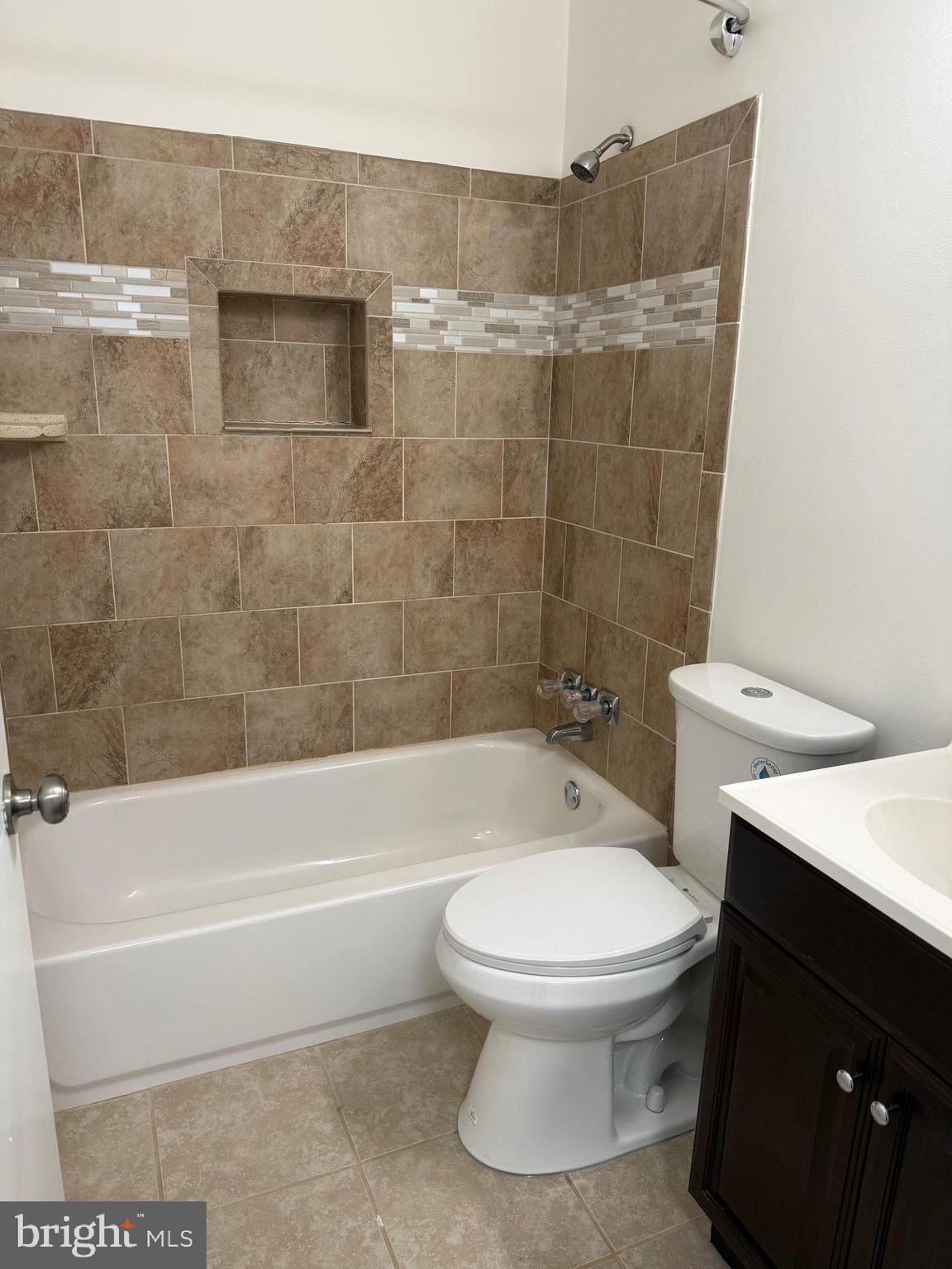 2511 Maryland Avenue, Unit 3 Baltimore, MD 21218 - Photo 6 of 11 a bathroom with a toilet and a shower