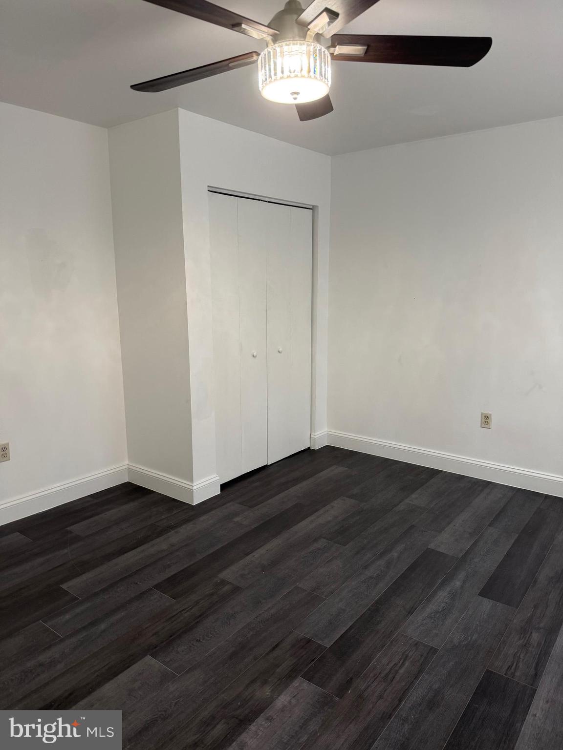 2511 Maryland Avenue, Unit 3 Baltimore, MD 21218 - Photo 9 of 11 a view of an empty room with wooden floor