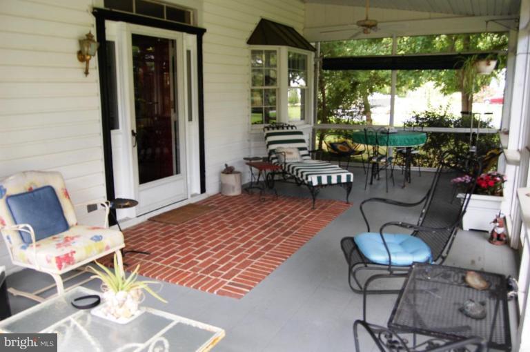 6354 Middle Point Road Neavitt, MD 21652 - Photo 3 of 28 Screened-in front porch