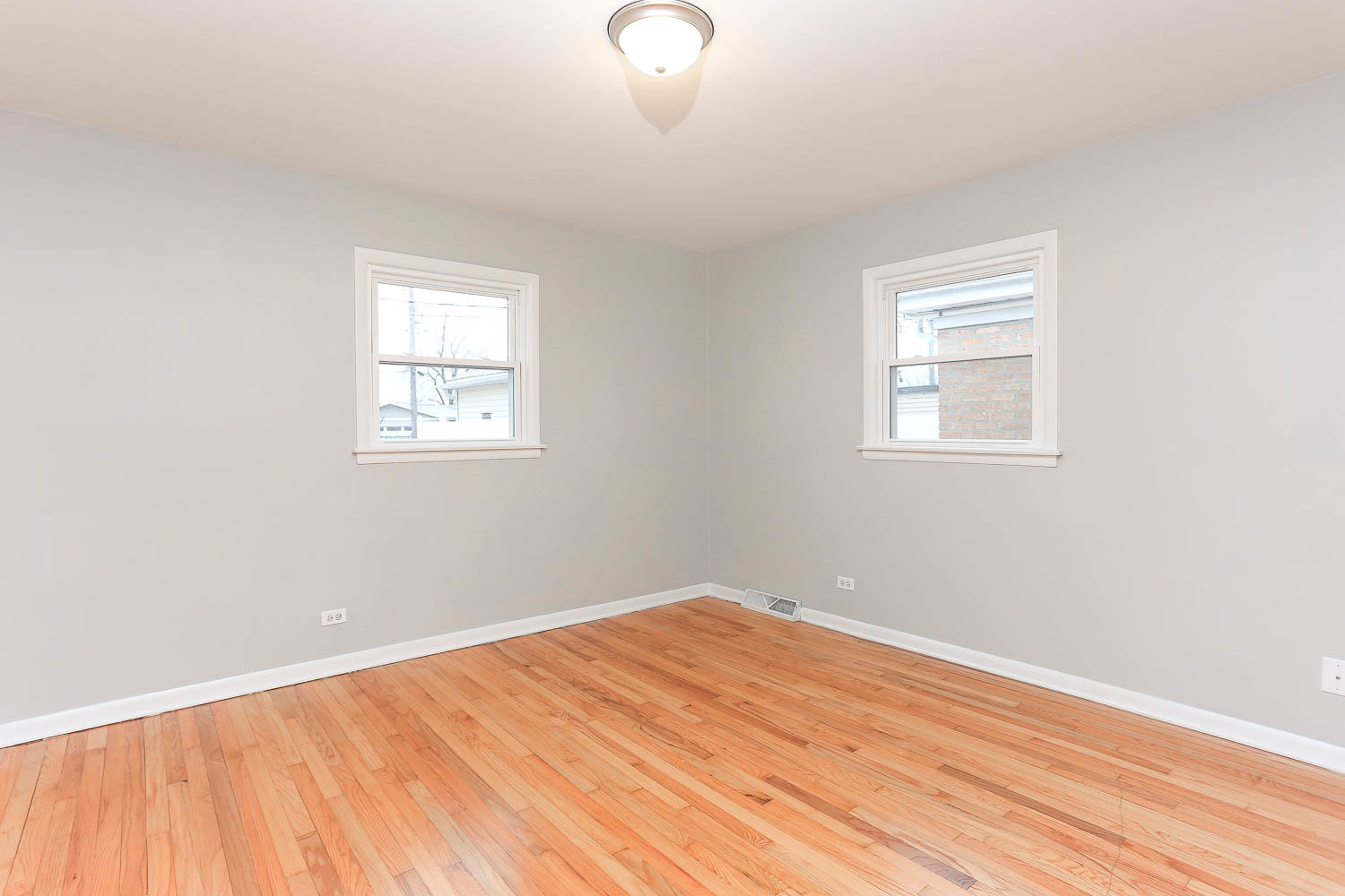 7736 State Road Burbank, IL 60459 - Photo 12 of 20 a view of a room with wooden floor and windows