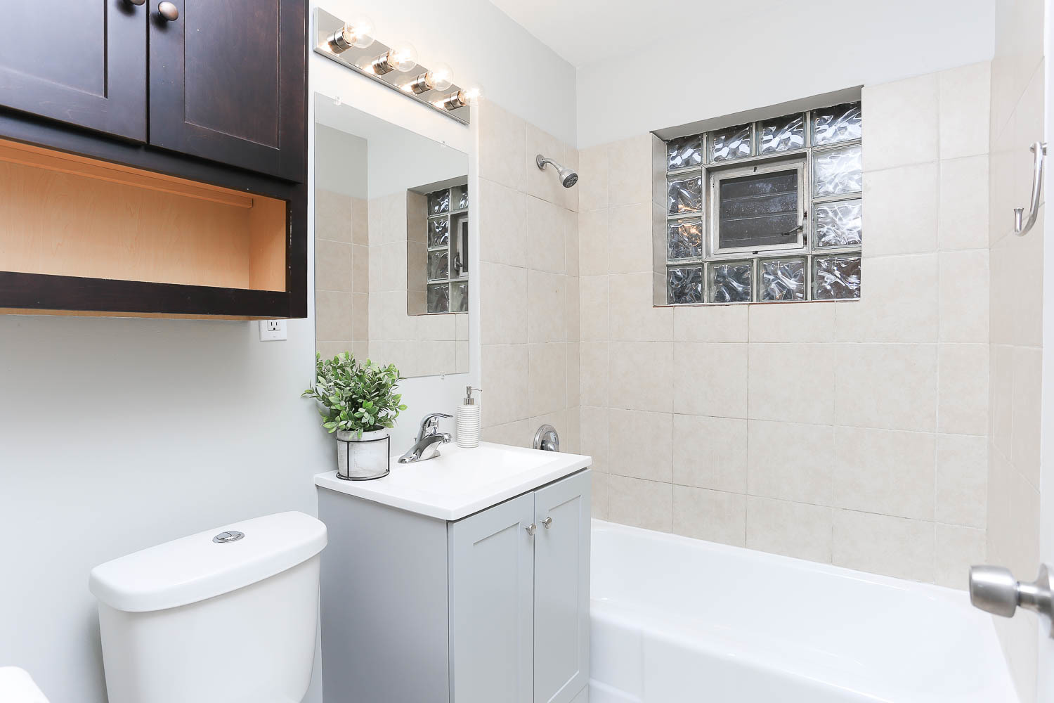 7736 State Road Burbank, IL 60459 - Photo 18 of 20 a bathroom with a sink a toilet and shower