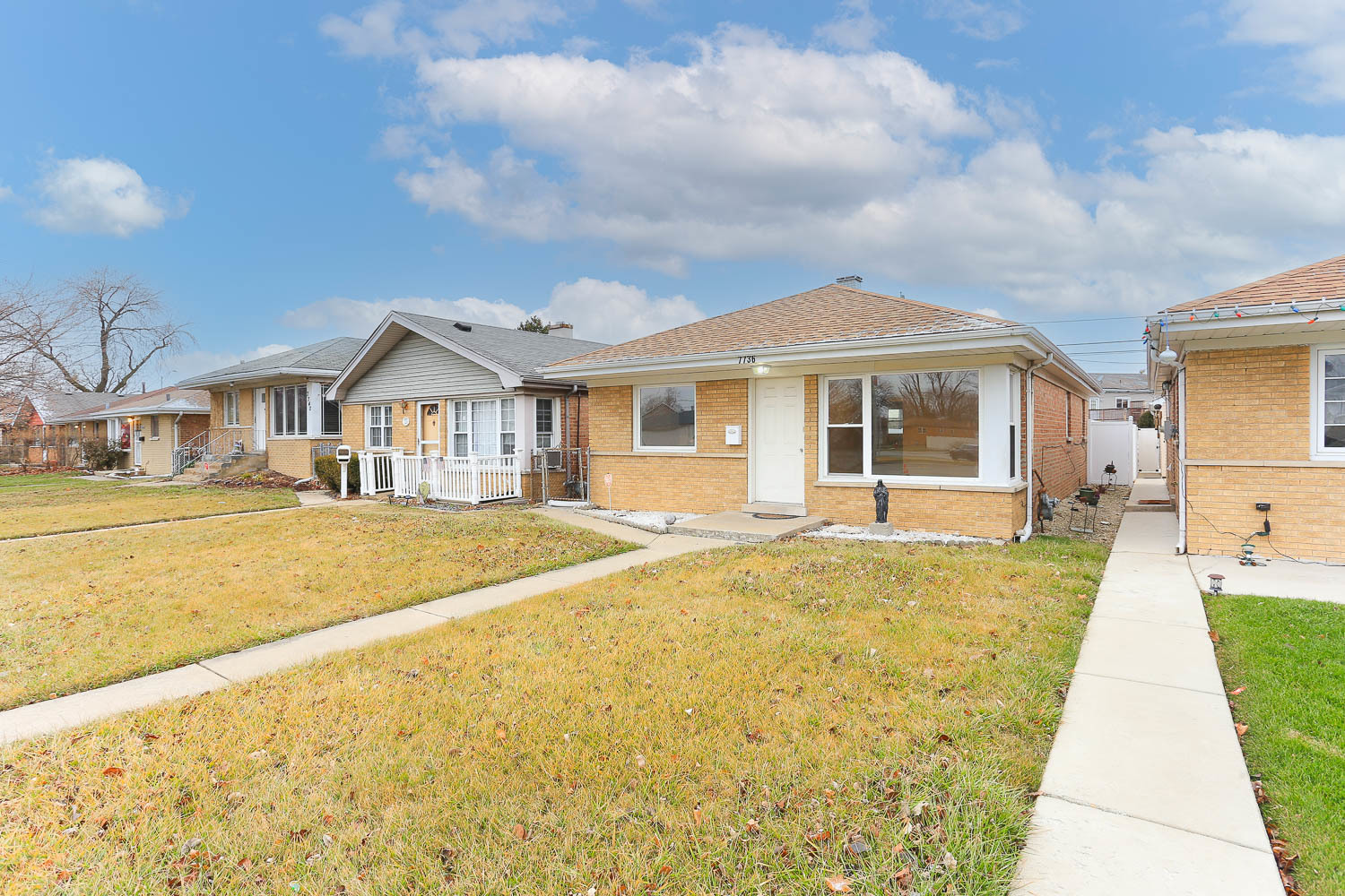 7736 State Road Burbank, IL 60459 - Photo 2 of 20 a front view of a house with swimming pool