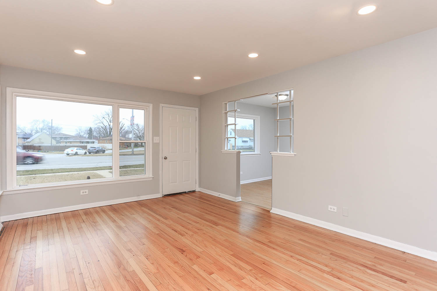 7736 State Road Burbank, IL 60459 - Photo 6 of 20 an empty room with wooden floor and windows